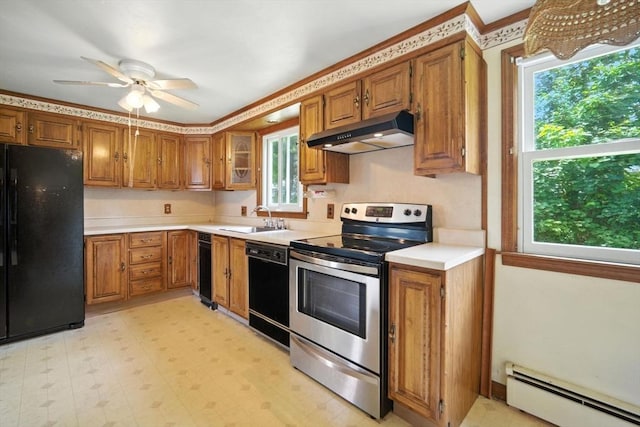 69 Michael St, Ludlow, MA 01056 - kitchen featuring black appliances, under cabinet range hood, a baseboard radiator, and brown cabinets