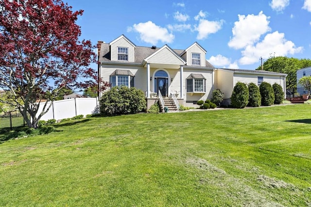 cape cod home with a front lawn, fence, and a chimney