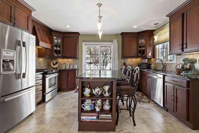 kitchen with open shelves, a sink, stainless steel appliances, decorative backsplash, and custom range hood