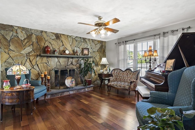 living area with ceiling fan and wood finished floors