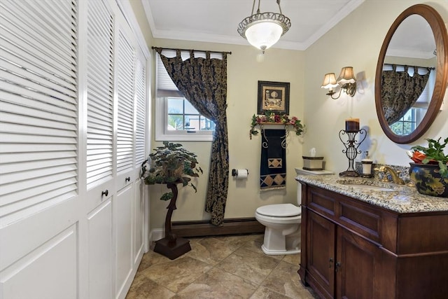 bathroom with baseboard heating, vanity, toilet, baseboards, and ornamental molding