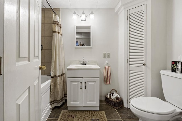 full bath with tile patterned flooring, vanity, toilet, shower / tub combo, and a closet