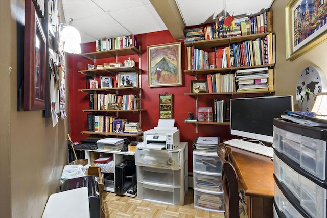 office area featuring a paneled ceiling