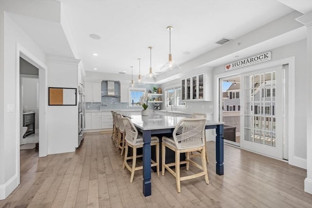33 Central Ave Unit 12, Scituate, MA 02050 - dining area with light wood-style flooring and recessed lighting