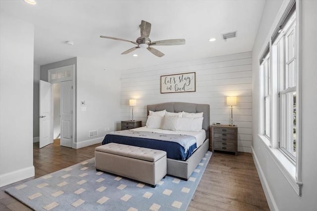33 Central Ave Unit 12, Scituate, MA 02050 - bedroom featuring wood finished floors, baseboards, recessed lighting, a ceiling fan, and wood walls