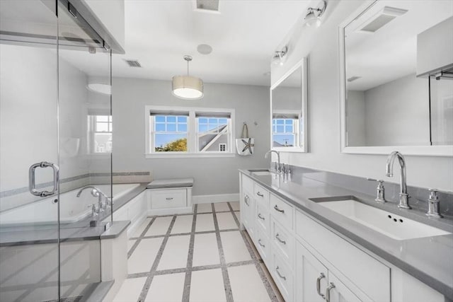 33 Central Ave Unit 12, Scituate, MA 02050 - bathroom with a shower stall, double vanity, baseboards, and a garden tub