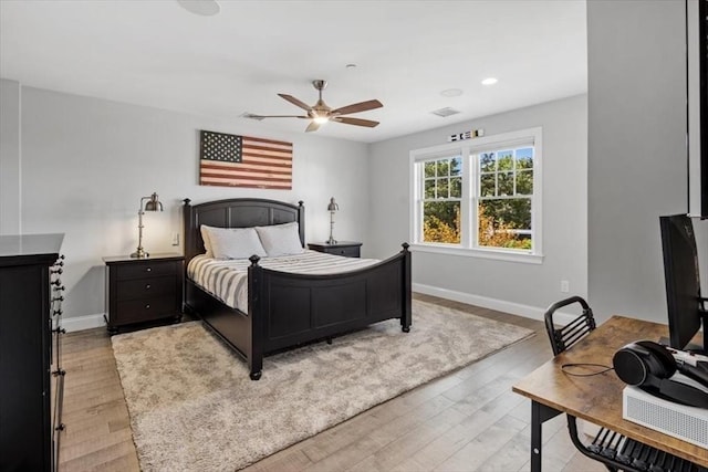 33 Central Ave Unit 12, Scituate, MA 02050 - bedroom with light wood-style flooring, baseboards, recessed lighting, and ceiling fan