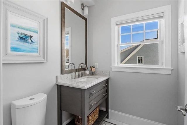33 Central Ave Unit 12, Scituate, MA 02050 - bathroom with vanity, baseboards, and toilet