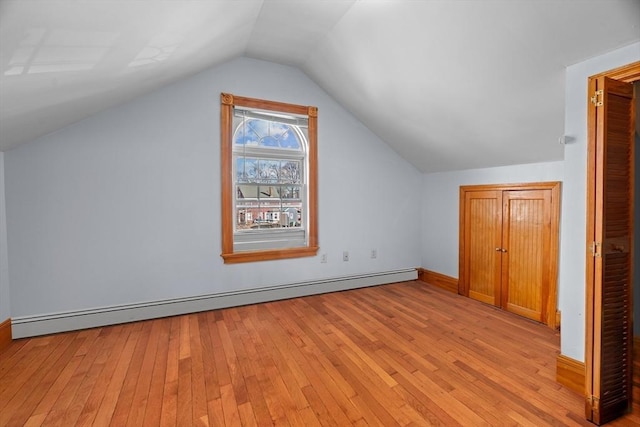 21 Alpine Unit 2Nd & 3Rd, Boston, MA 02119 - bonus room with baseboard heating, light wood-type flooring, and vaulted ceiling