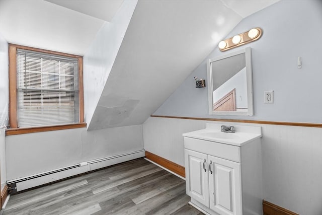 21 Alpine Unit 2Nd & 3Rd, Boston, MA 02119 - bathroom featuring a baseboard heating unit, vanity, vaulted ceiling, and wood finished floors