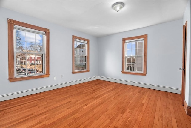 21 Alpine Unit 2Nd & 3Rd, Boston, MA 02119 - empty room with light wood-style flooring and baseboard heating