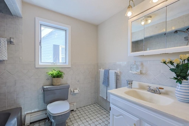 3 Nira St, Malden, MA 02148 - full bathroom featuring a baseboard radiator, tile walls, vanity, a tub, and a wainscoted wall