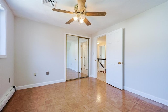 3 Nira St, Malden, MA 02148 - unfurnished bedroom with a baseboard radiator, a ceiling fan, and a closet
