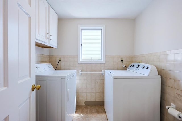3 Nira St, Malden, MA 02148 - laundry area with tile walls, separate washer and dryer, light tile patterned floors, cabinet space, and a wainscoted wall