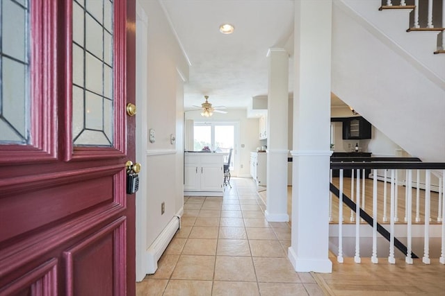 3 Nira St, Malden, MA 02148 - entryway with light tile patterned flooring, a ceiling fan, stairway, a baseboard radiator, and ornate columns