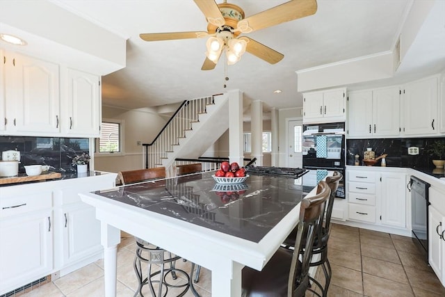 3 Nira St, Malden, MA 02148 - kitchen featuring black appliances, light tile patterned floors, a breakfast bar area, backsplash, and recessed lighting