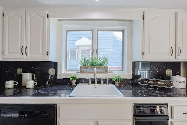 3 Nira St, Malden, MA 02148 - kitchen with black dishwasher, white cabinetry, and decorative backsplash