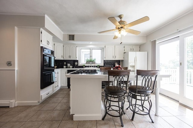 3 Nira St, Malden, MA 02148 - kitchen featuring tasteful backsplash, light tile patterned floors, white refrigerator with ice dispenser, ceiling fan, and ornamental molding