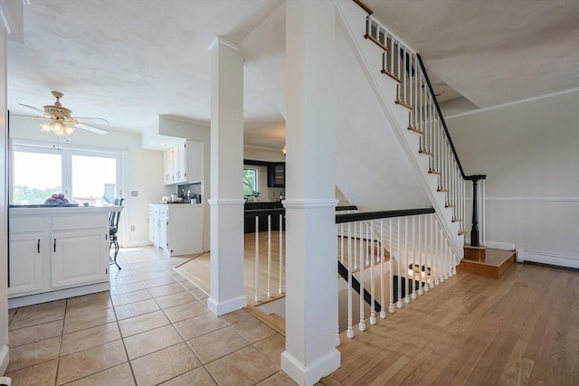 3 Nira St, Malden, MA 02148 - stairs featuring ceiling fan, a baseboard radiator, and ornate columns