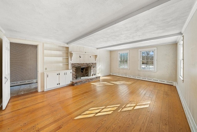 unfurnished living room featuring a baseboard radiator, a textured ceiling, a brick fireplace, and light wood-type flooring