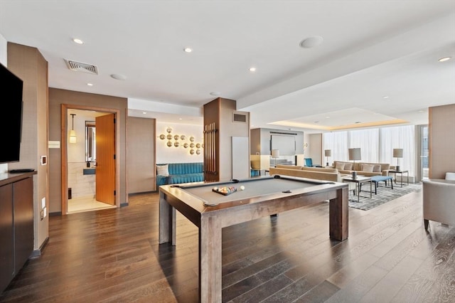 rec room featuring a tray ceiling, wood-type flooring, and billiards