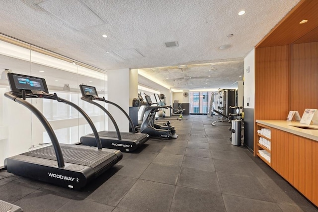 workout area featuring a textured ceiling