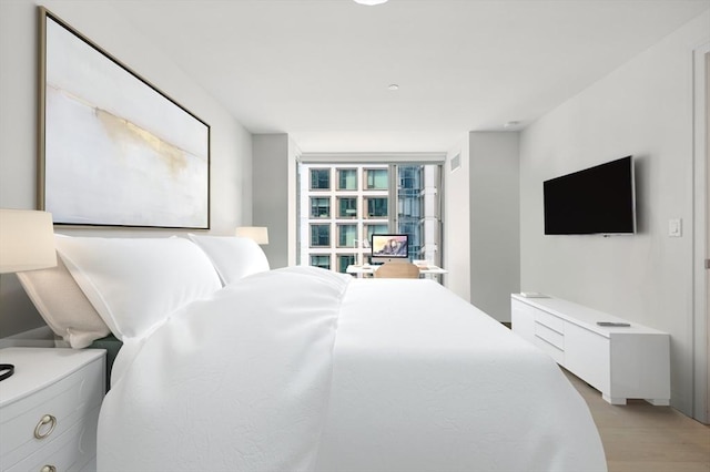 bedroom featuring light hardwood / wood-style flooring