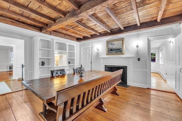 680 Old Connecticut Path, Framingham, MA 01701 - dining area featuring wood ceiling, light wood-type flooring, a fireplace with flush hearth, beam ceiling, and a baseboard heating unit