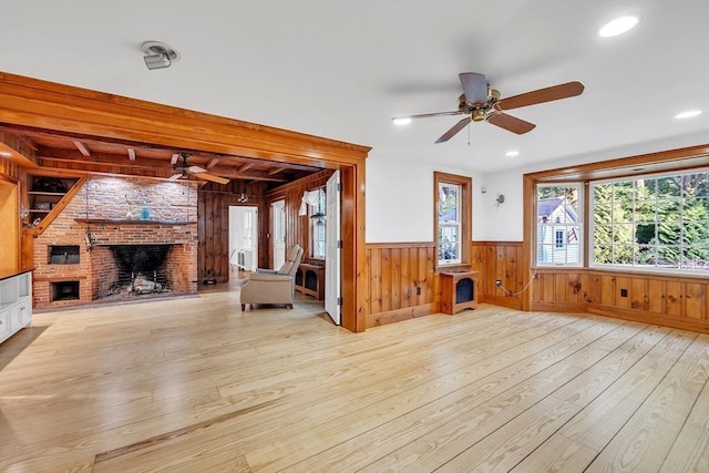 680 Old Connecticut Path, Framingham, MA 01701 - unfurnished living room featuring a ceiling fan, hardwood / wood-style flooring, a wainscoted wall, plenty of natural light, and wooden walls