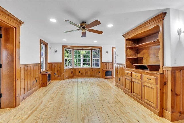 680 Old Connecticut Path, Framingham, MA 01701 - unfurnished living room with wainscoting, a ceiling fan, light wood-type flooring, recessed lighting, and wood walls