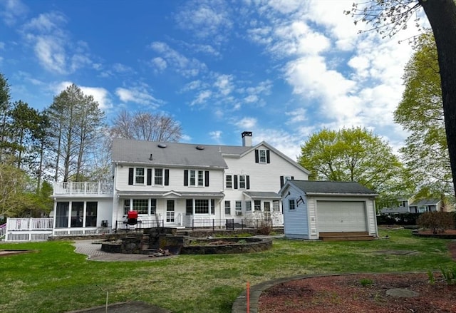 680 Old Connecticut Path, Framingham, MA 01701 - back of property featuring a chimney, a balcony, an outbuilding, a lawn, and a patio area