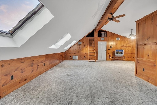 680 Old Connecticut Path, Framingham, MA 01701 - additional living space featuring a skylight, wood walls, a ceiling fan, and carpet flooring