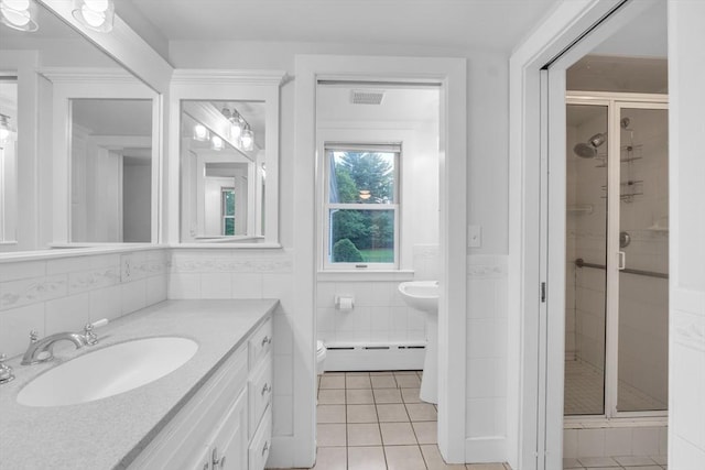 680 Old Connecticut Path, Framingham, MA 01701 - full bathroom with a sink, tile walls, baseboard heating, a stall shower, and tile patterned floors