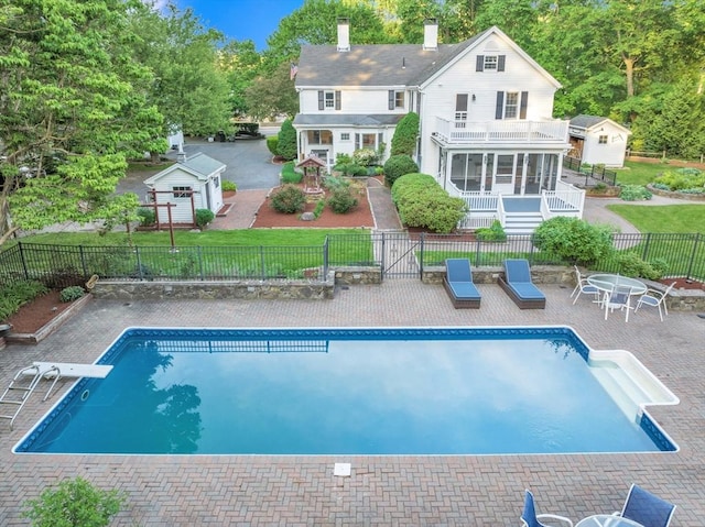 680 Old Connecticut Path, Framingham, MA 01701 - back of house with a balcony, a chimney, and a patio area