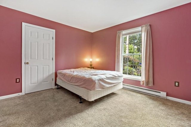 carpeted bedroom with baseboard heating