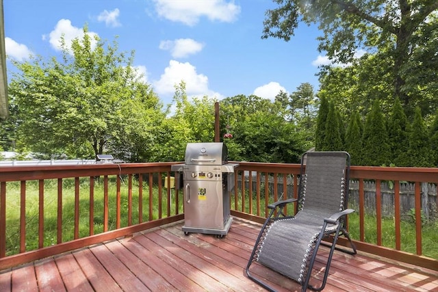 wooden deck featuring area for grilling