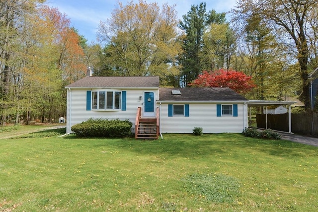 133 E Main St, Norton, MA 02766 - view of front facade with a front lawn, a chimney, a carport, and asphalt driveway