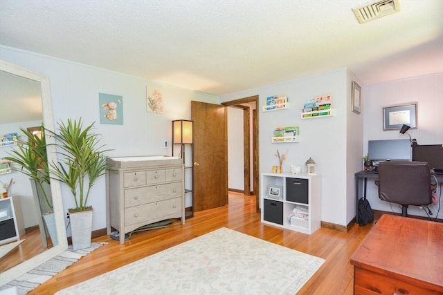 133 E Main St, Norton, MA 02766 - bedroom with light wood-style floors and an office area