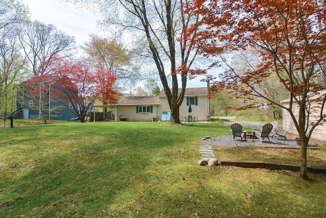 133 E Main St, Norton, MA 02766 - view of grassy yard featuring a fire pit