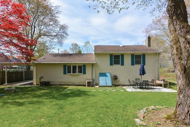 133 E Main St, Norton, MA 02766 - rear view of property featuring a patio and a chimney