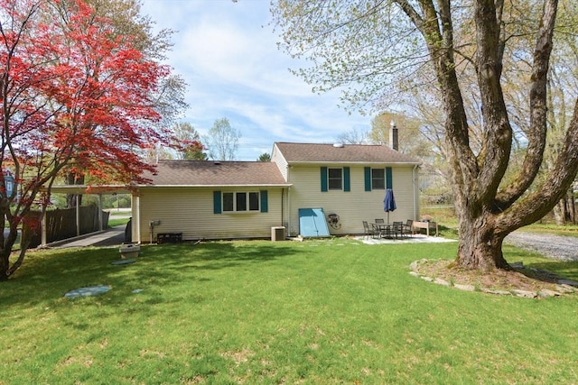133 E Main St, Norton, MA 02766 - back of property with a lawn, a patio area, and central AC