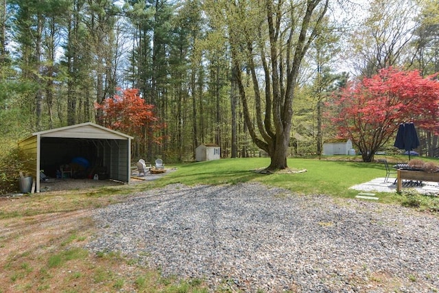 133 E Main St, Norton, MA 02766 - view of grassy yard featuring a carport