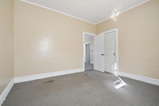 carpeted spare room with ornamental molding