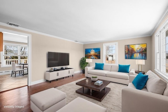 living room featuring a wealth of natural light, visible vents, and crown molding