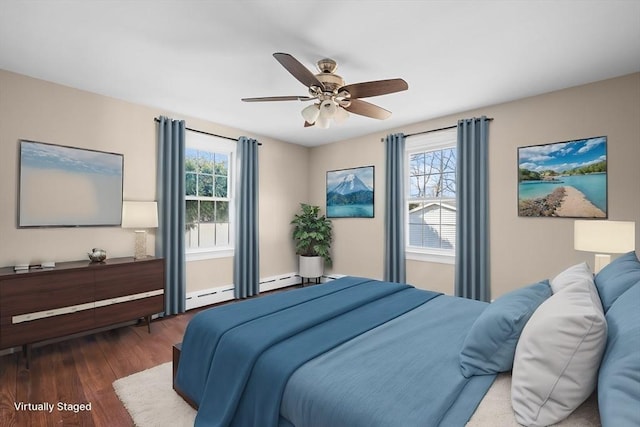 bedroom with multiple windows, wood finished floors, and ceiling fan