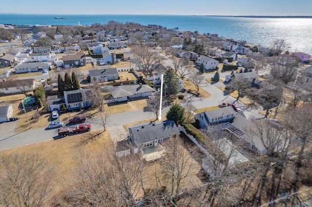 drone / aerial view with a residential view and a water view