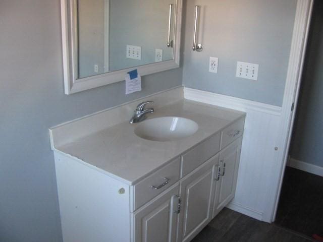 bathroom featuring vanity and hardwood / wood-style flooring