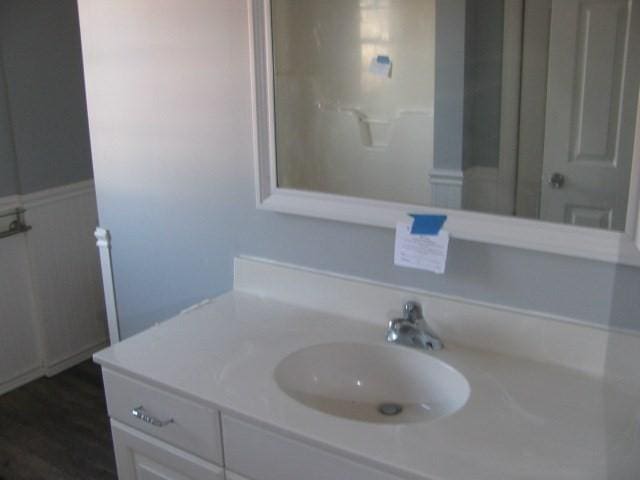 bathroom featuring hardwood / wood-style floors and vanity