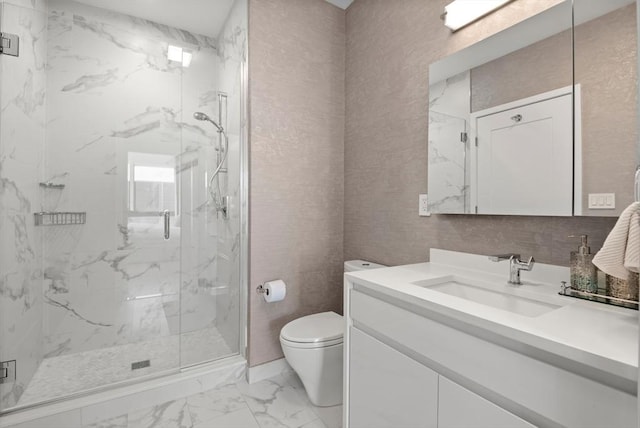 bathroom featuring vanity, toilet, and walk in shower