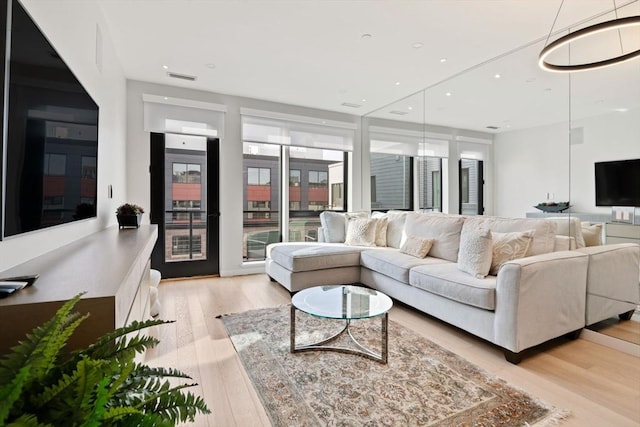 living room with light hardwood / wood-style floors